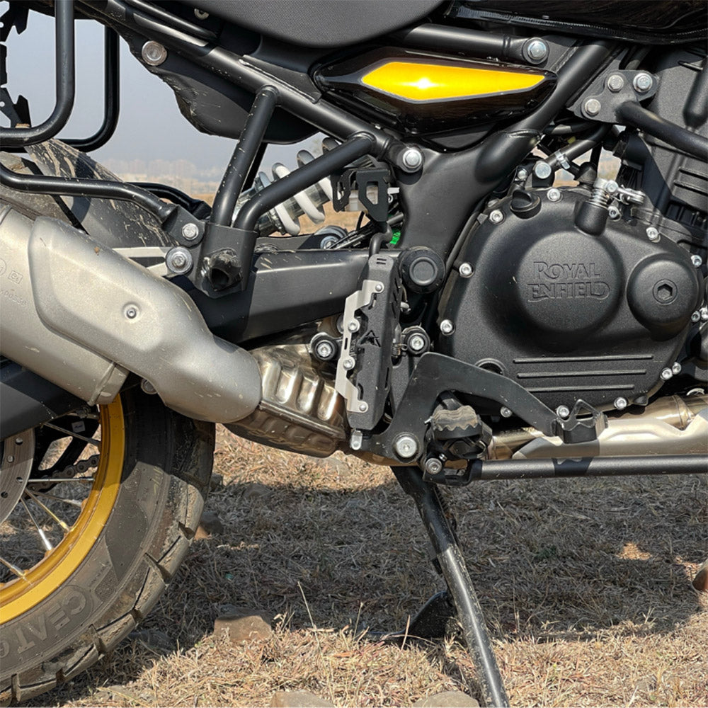 Matte black master cylinder guard installed on motorcycle, protective bracket visible