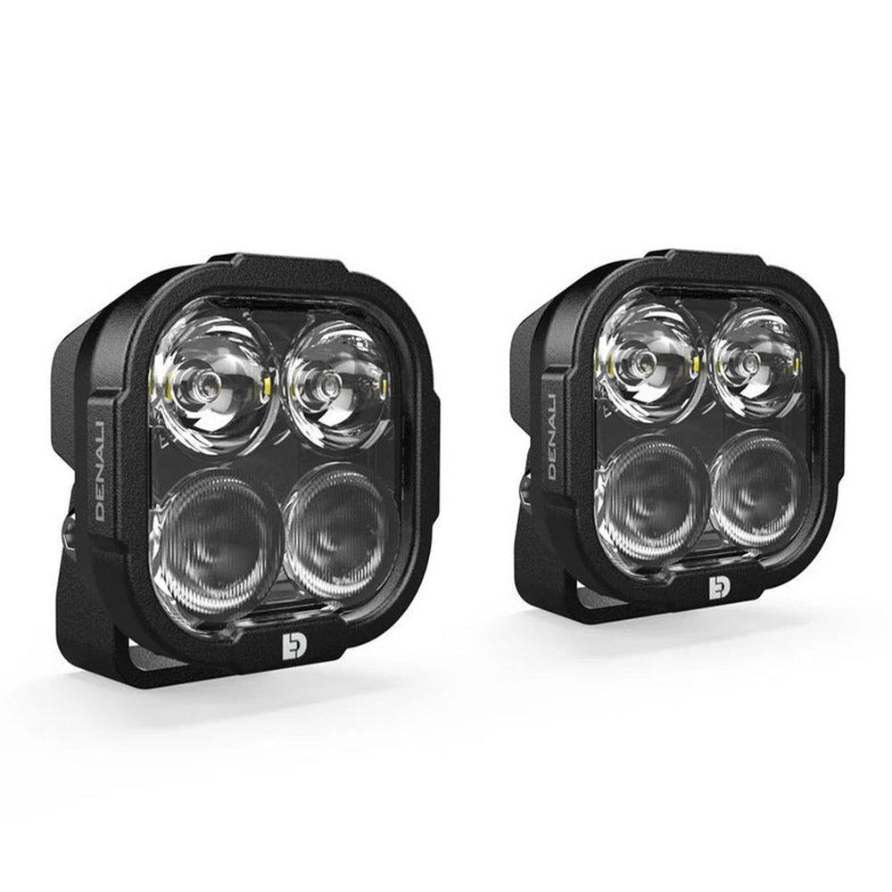 Pair of black quad-lens driving light pods with clear covers, mounted brackets