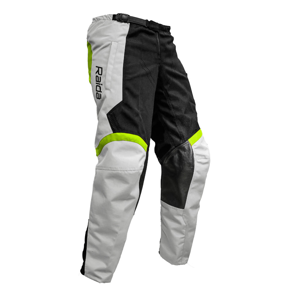 Off-road riding pants in grey with hi-viz green panels and black knee guards