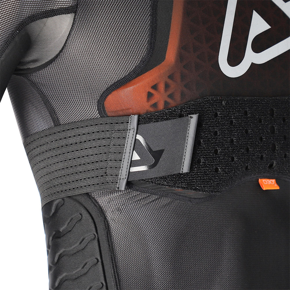 Black armor vest close-up of side straps, D3O panel, and molded logo