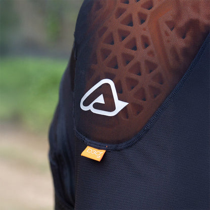 Black body armor vest with orange-brown impact pad, white logo, and D3O tag