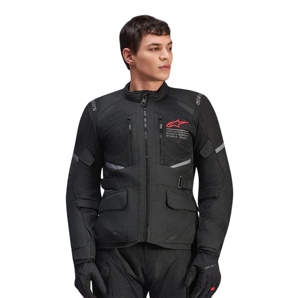 Motorcycle jacket in black with zip front, chest pockets, and multiple strap details