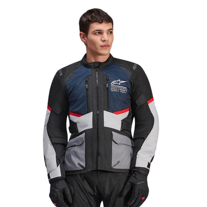 Motorcycle jacket with blue panels, black base, red/white accents, front zip and cargo pockets
