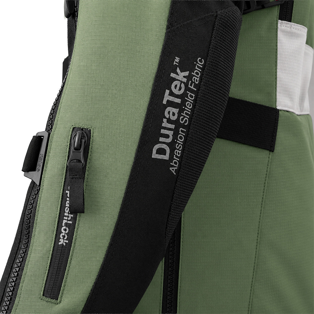 Jacket fabric detail: black Duratek strap on olive green shell with textured paneling.