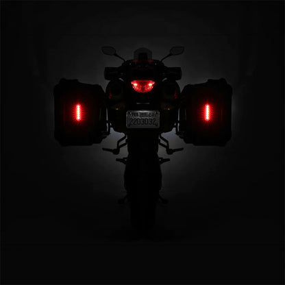 Red LED brake light and turn signals glowing on the motorcycle rear