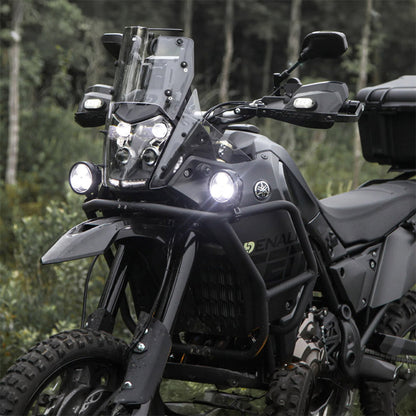 Black auxiliary LED light pods mounted on motorcycle front, small lights in close view
