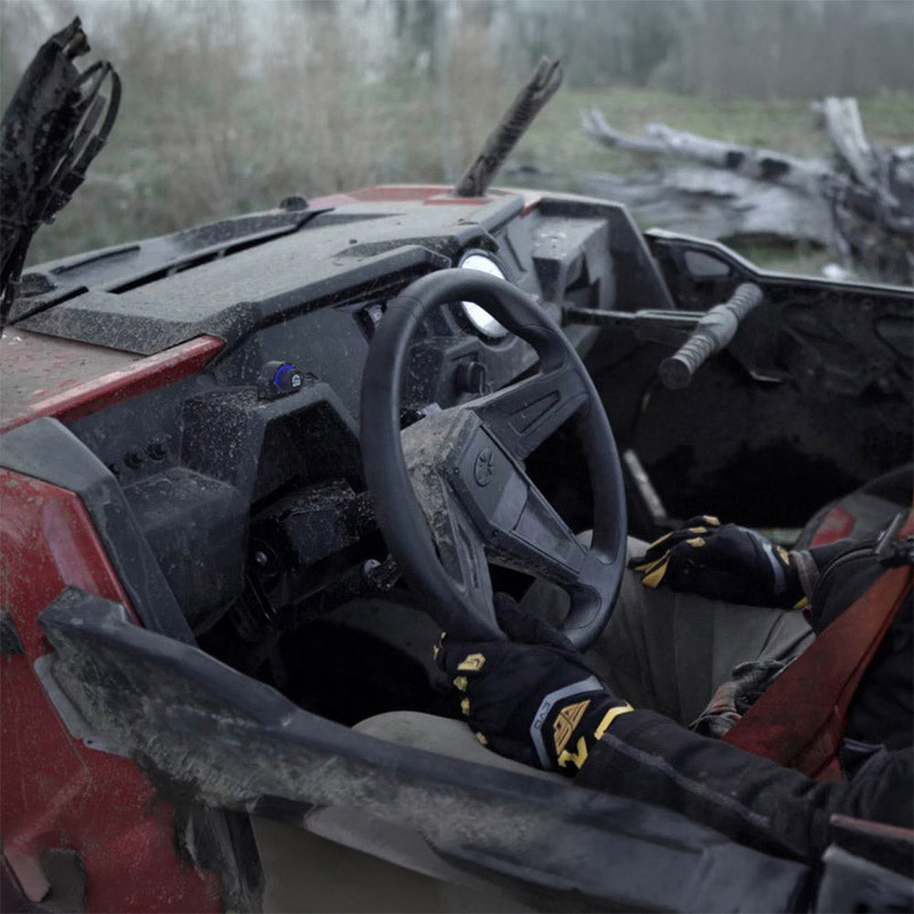 DialDim controller mounted near steering wheel on off-road vehicle dashboard