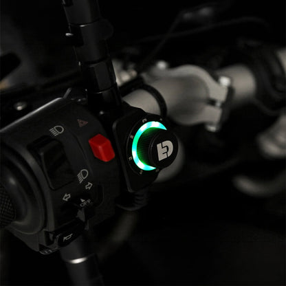 Close-up of DialDim controller dial with green LED ring on handlebar