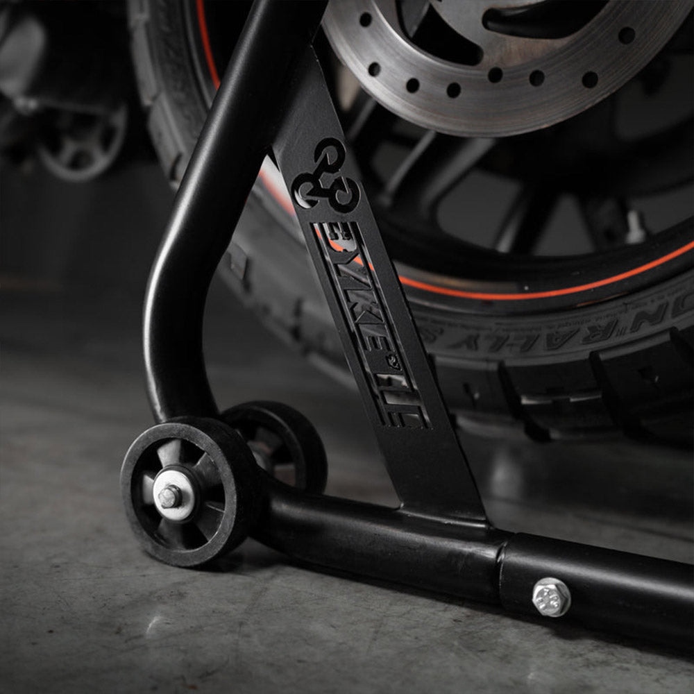 Black paddock stand base with caster wheel and bolt detail