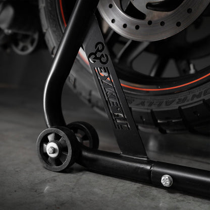 Black paddock stand base with caster wheel and bolt detail