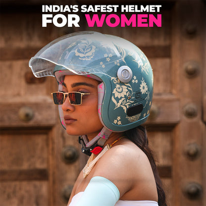 Marine blue floral motorcycle helmet with clear visor on model