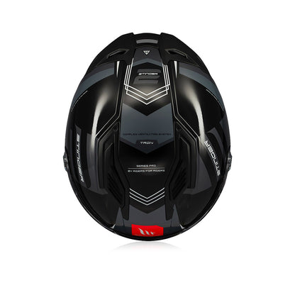 Gloss black full-face helmet back panel with geometric vent lines and red MT badge