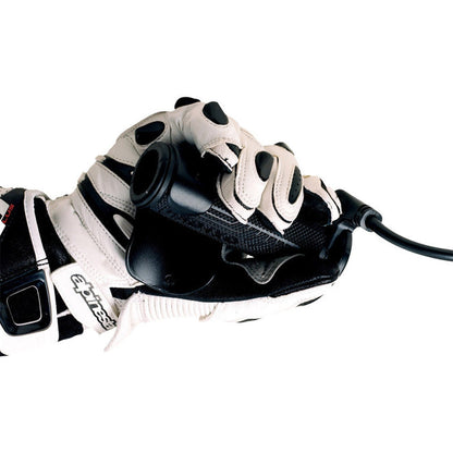 Throttle assist used while riding, shown on a gloved hand gripping the device