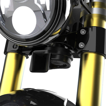 Black motorcycle horn unit with mounting bracket, installed near fork area