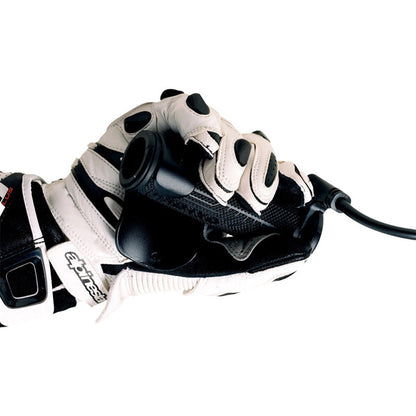 Black throttle assist mounted near handlebar, shown with riding glove