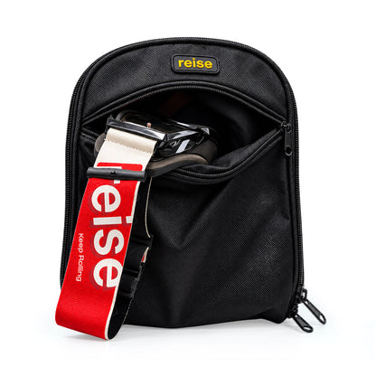 Black helmet bag with open top showing straps inside and reise logo patch