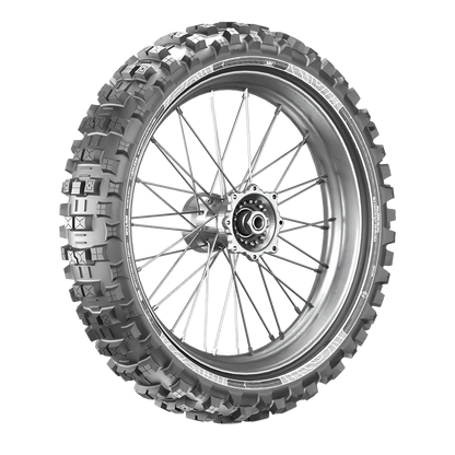 Front tubeless tyre angled front view on spoked rim with large tread lugs