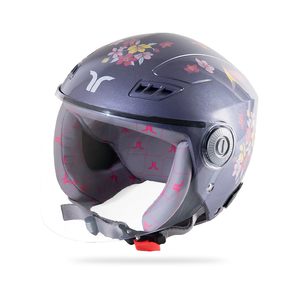 Motorcycle riding helmet 3/4 view with floral print, clear visor, and ventilation ports