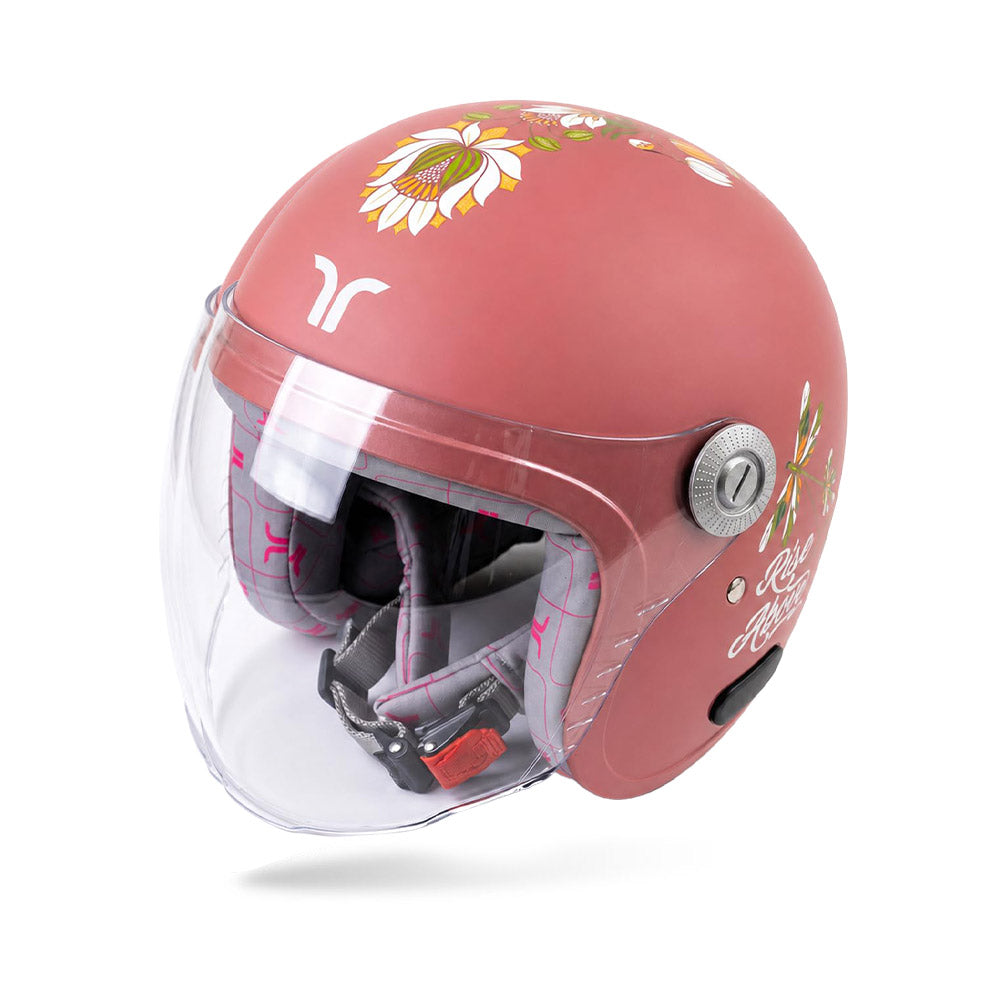 Motorcycle riding helmet with clear visor open, showing padded interior in coral