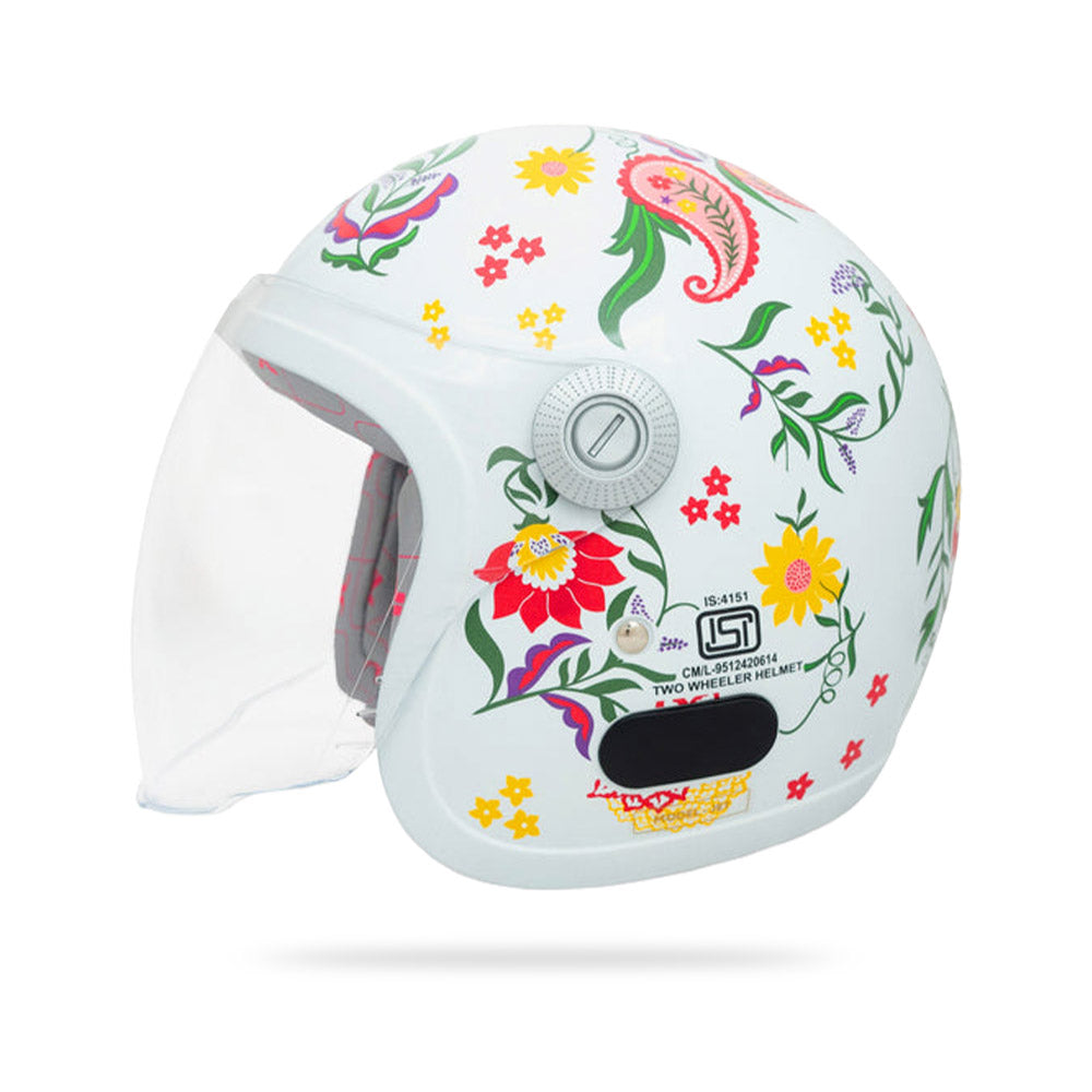 Pearl white motorcycle helmet with floral print, rear label panel, and clear visor