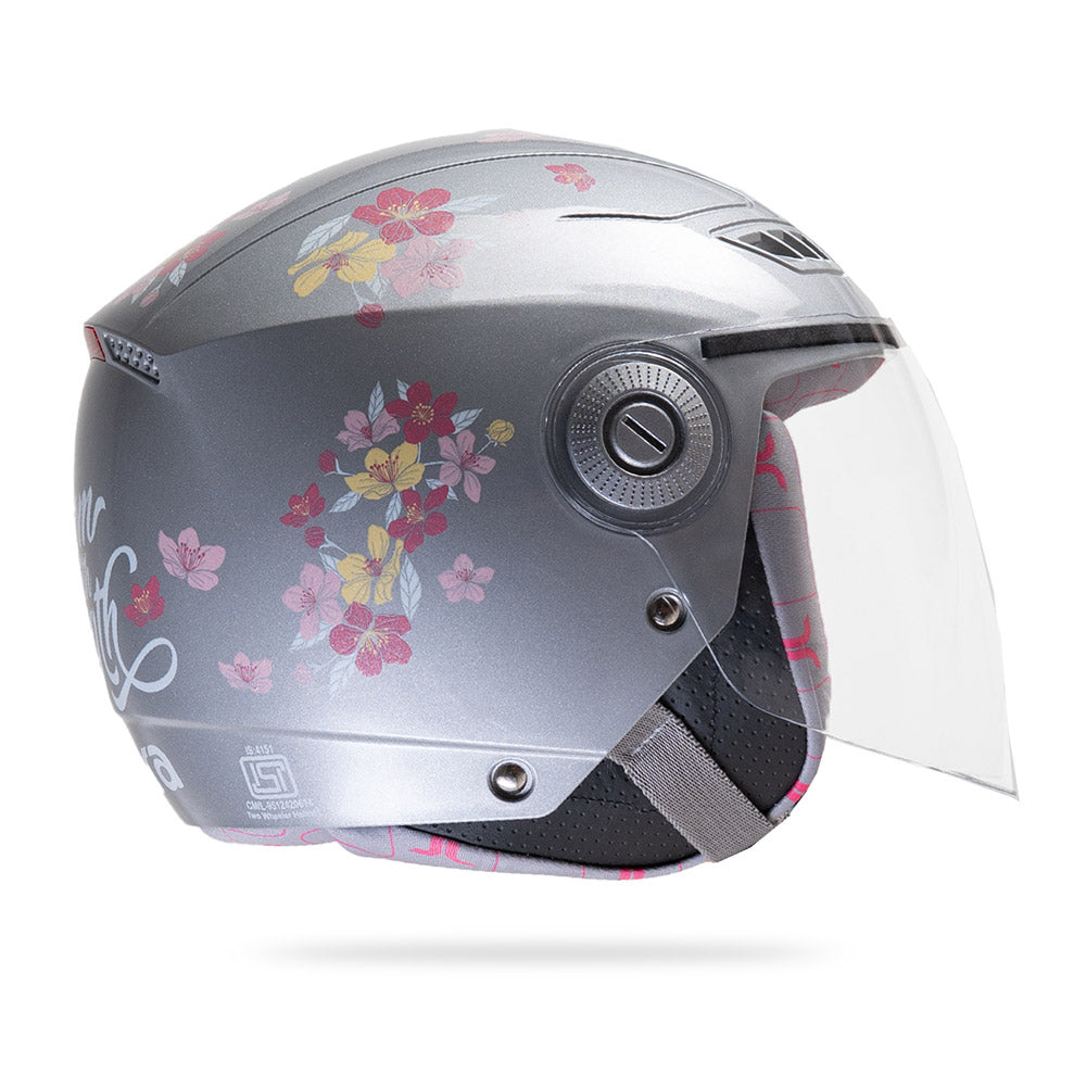 Gray-silver motorcycle helmet with clear visor and colorful floral side graphics