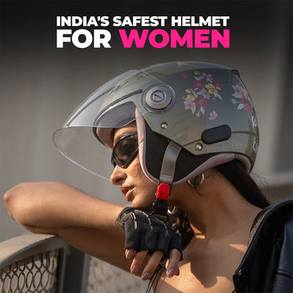 Women’s jade green motorcycle helmet with clear visor and floral decorations