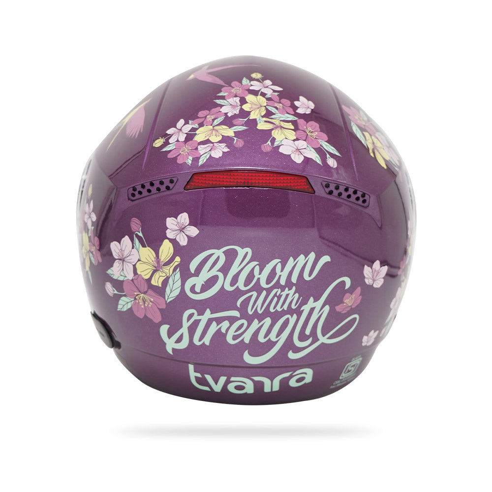 Violet full-face motorcycle helmet with "Bloom with Strength" floral print
